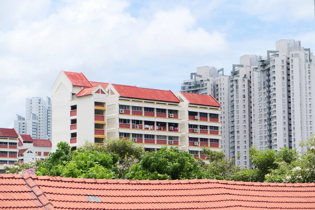 low angle view of Singapore residential buildings against blue sky